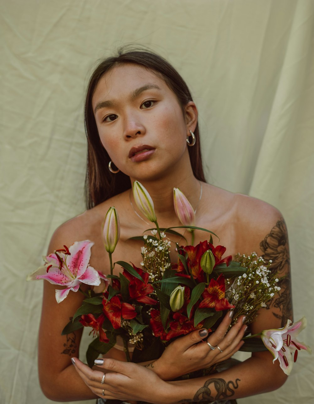 Portrait of Woman Wearing a Crown and Holding Bouquet of Flowers