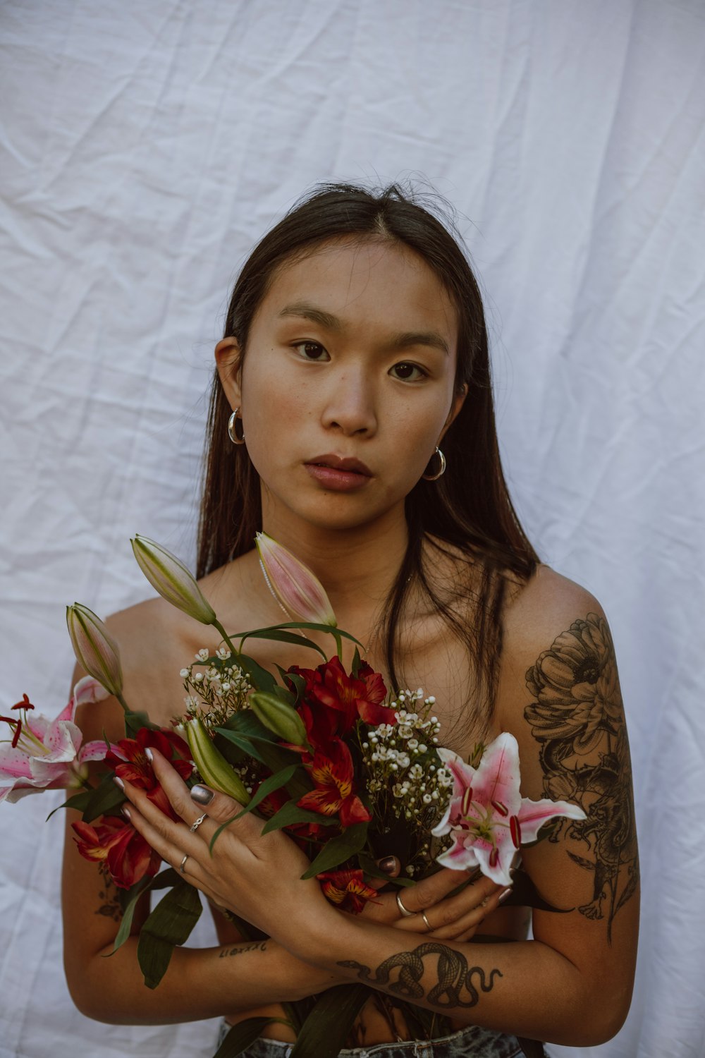 woman holding bouquet of flowers