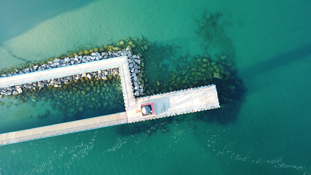 aerial view of white dock on body of water during daytime