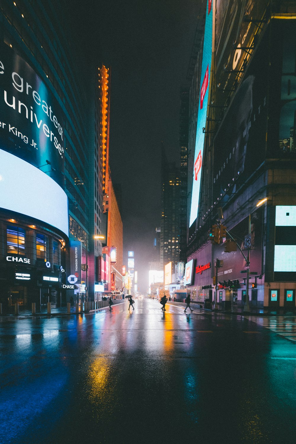 people walking on street during night time