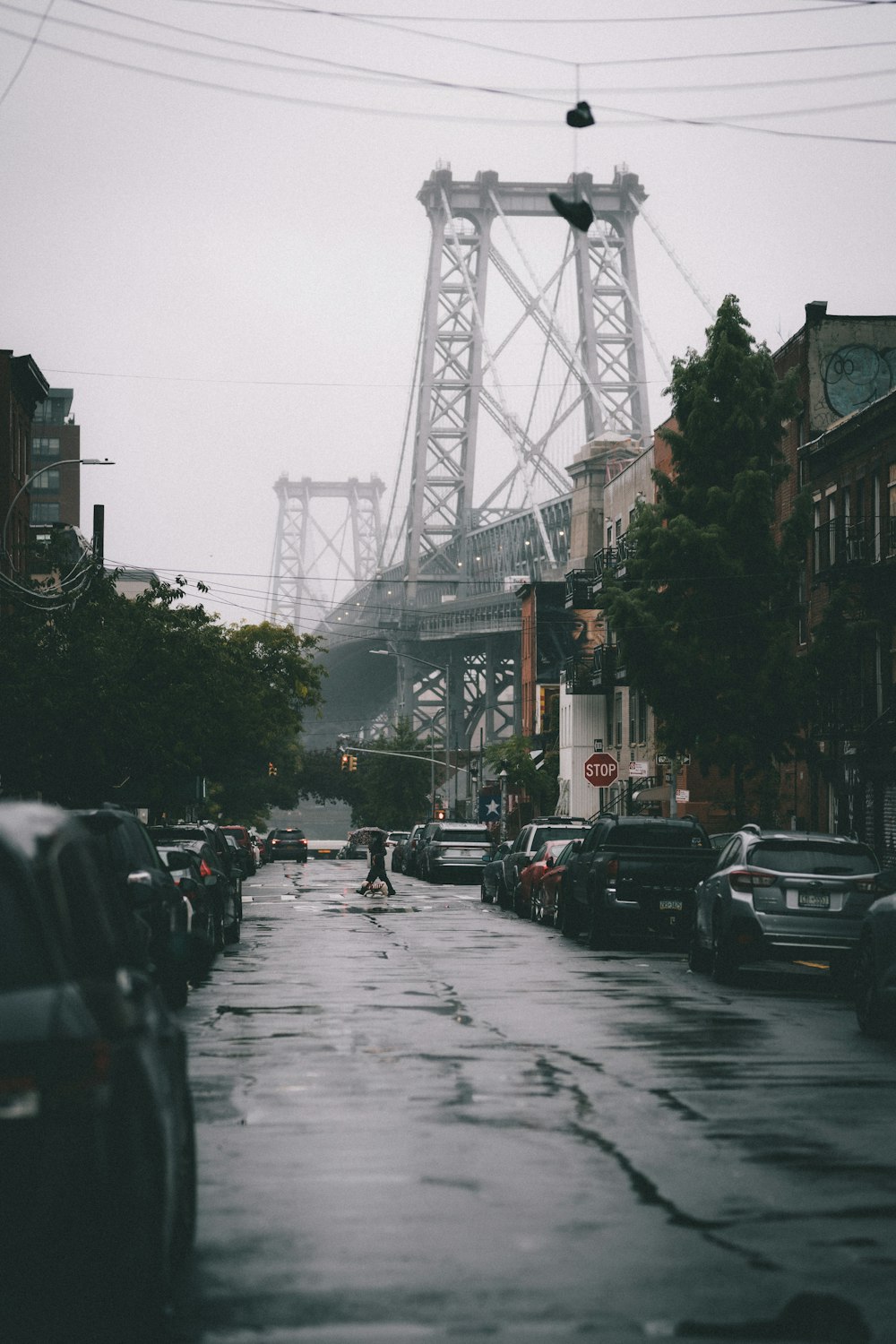 cars parked on street near bridge during daytime