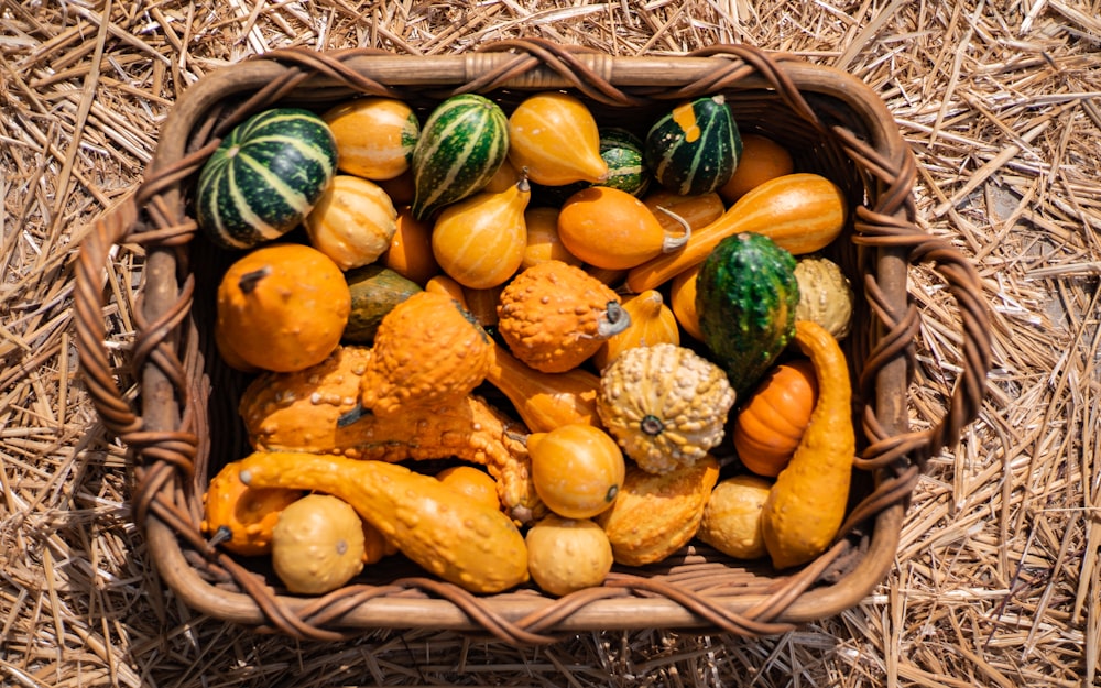 yellow and green fruits on brown woven basket