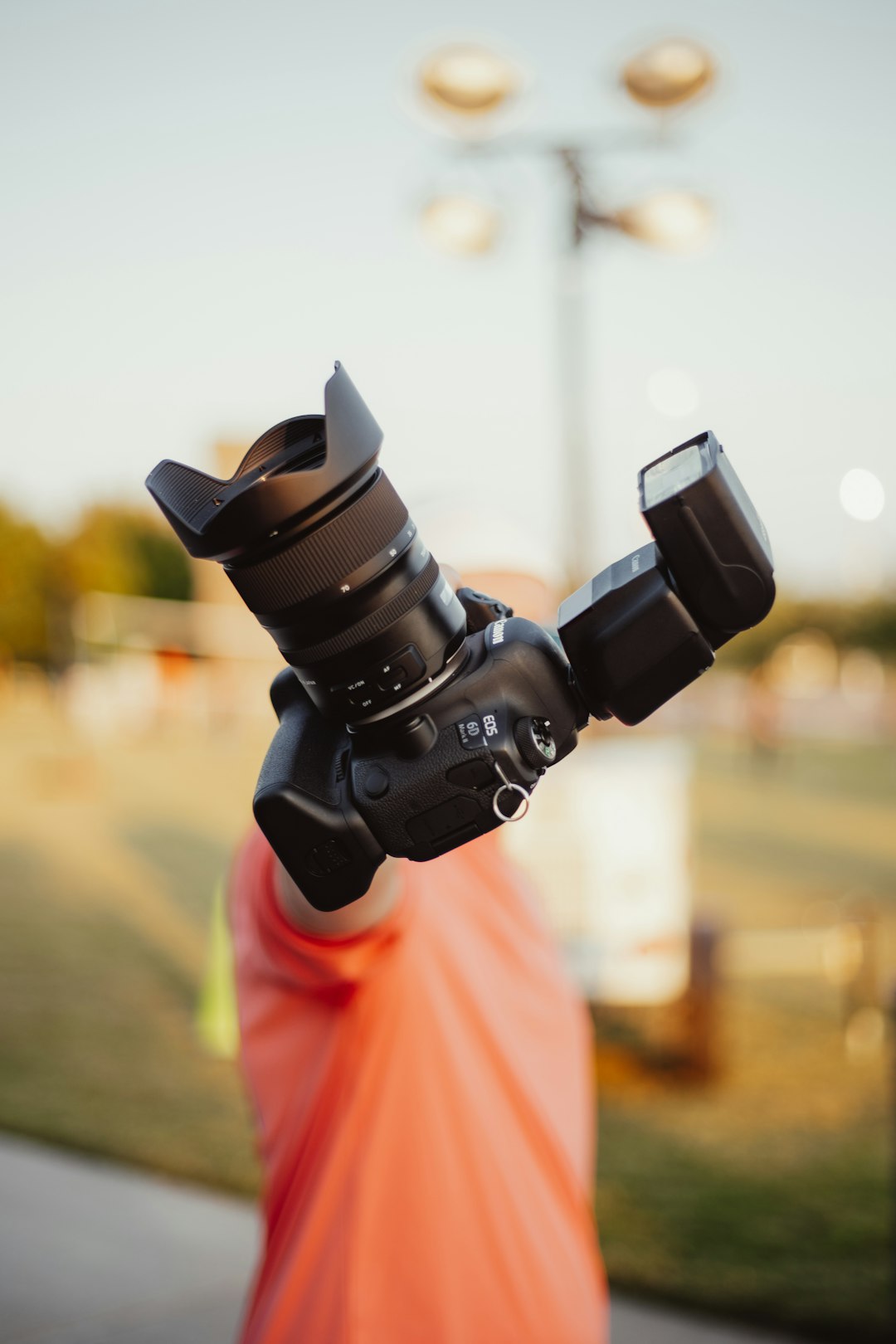 person holding black dslr camera