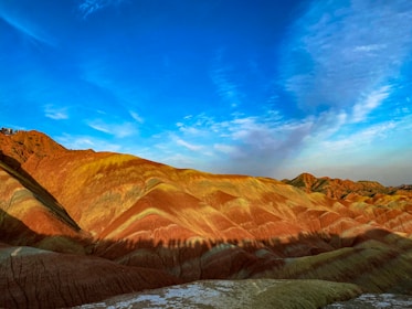 Detailed illustration of mountains, valleys, and plains in vibrant colors.