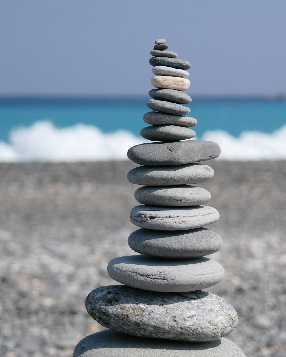 gray concrete spiral stone near body of water during daytime