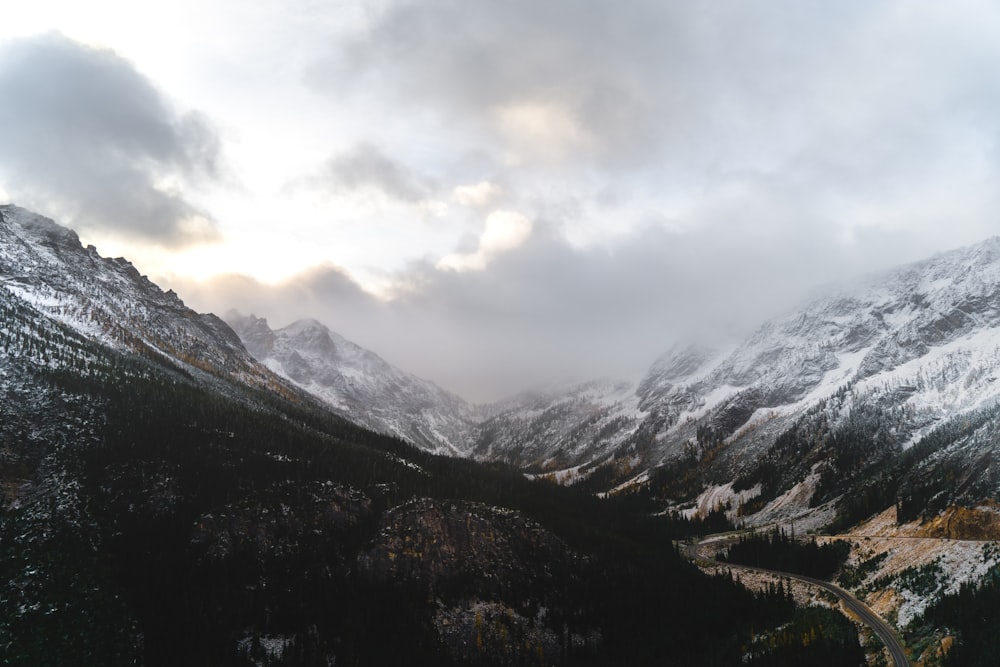 green and brown mountains under white clouds during daytime