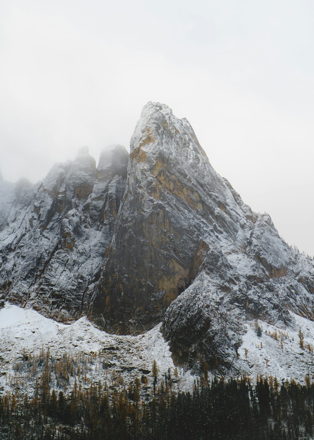 gray rocky mountain under white sky during daytime