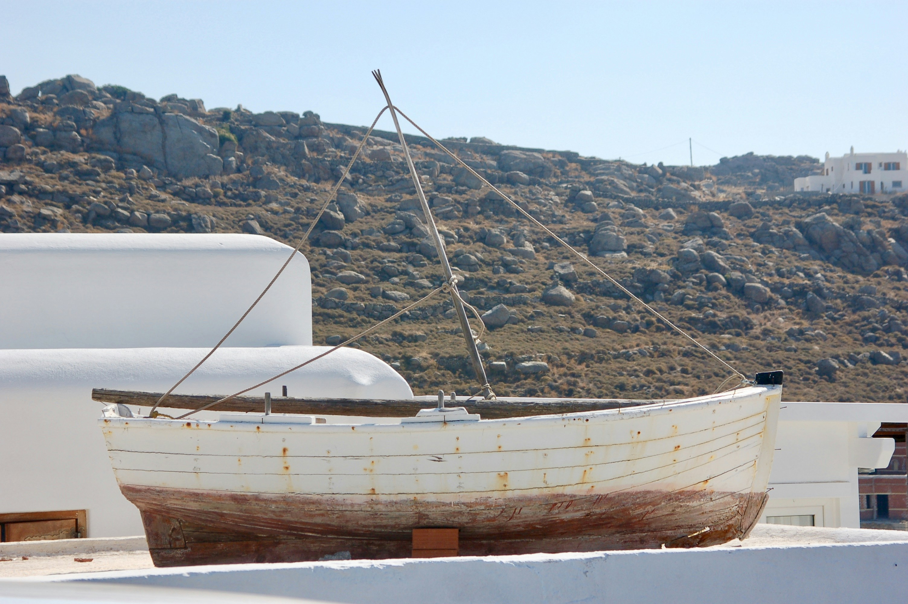 white and brown boat on water during daytime