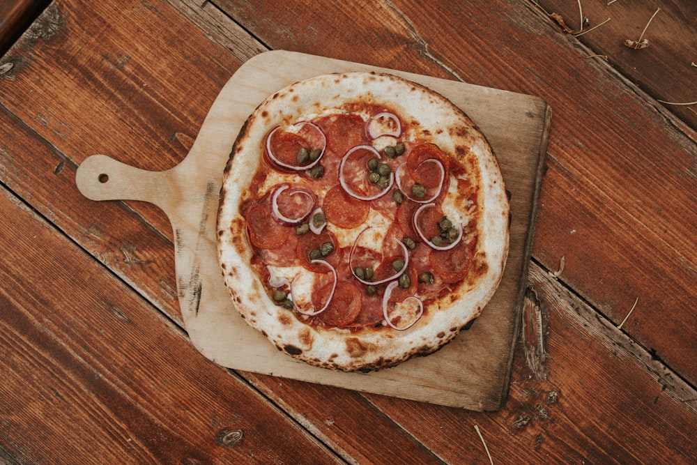 pizza on brown wooden table