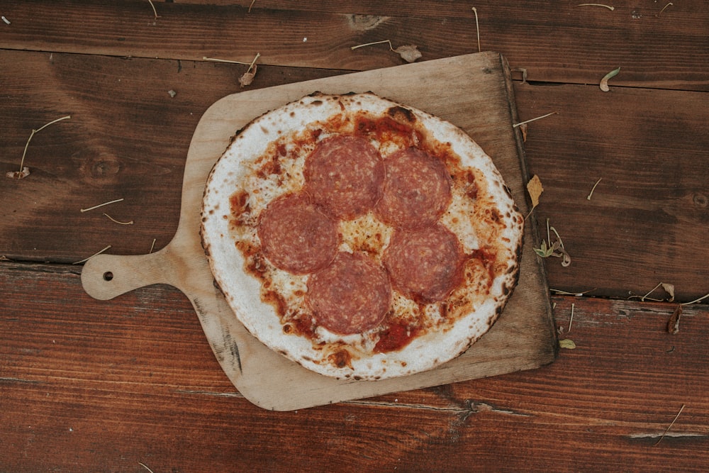 pizza on brown wooden tray