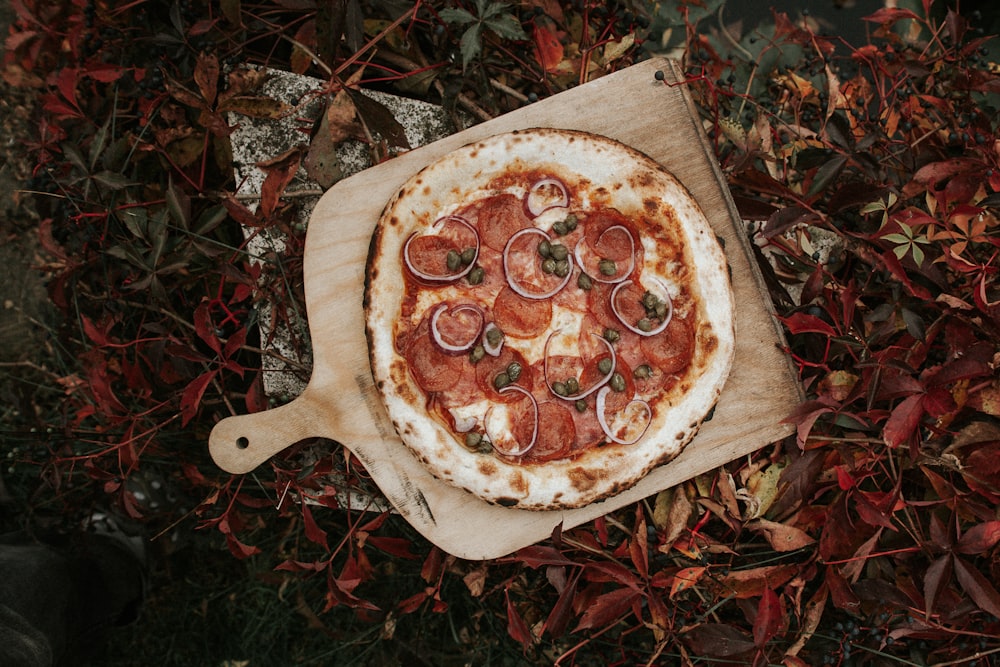 pizza on brown wooden tray