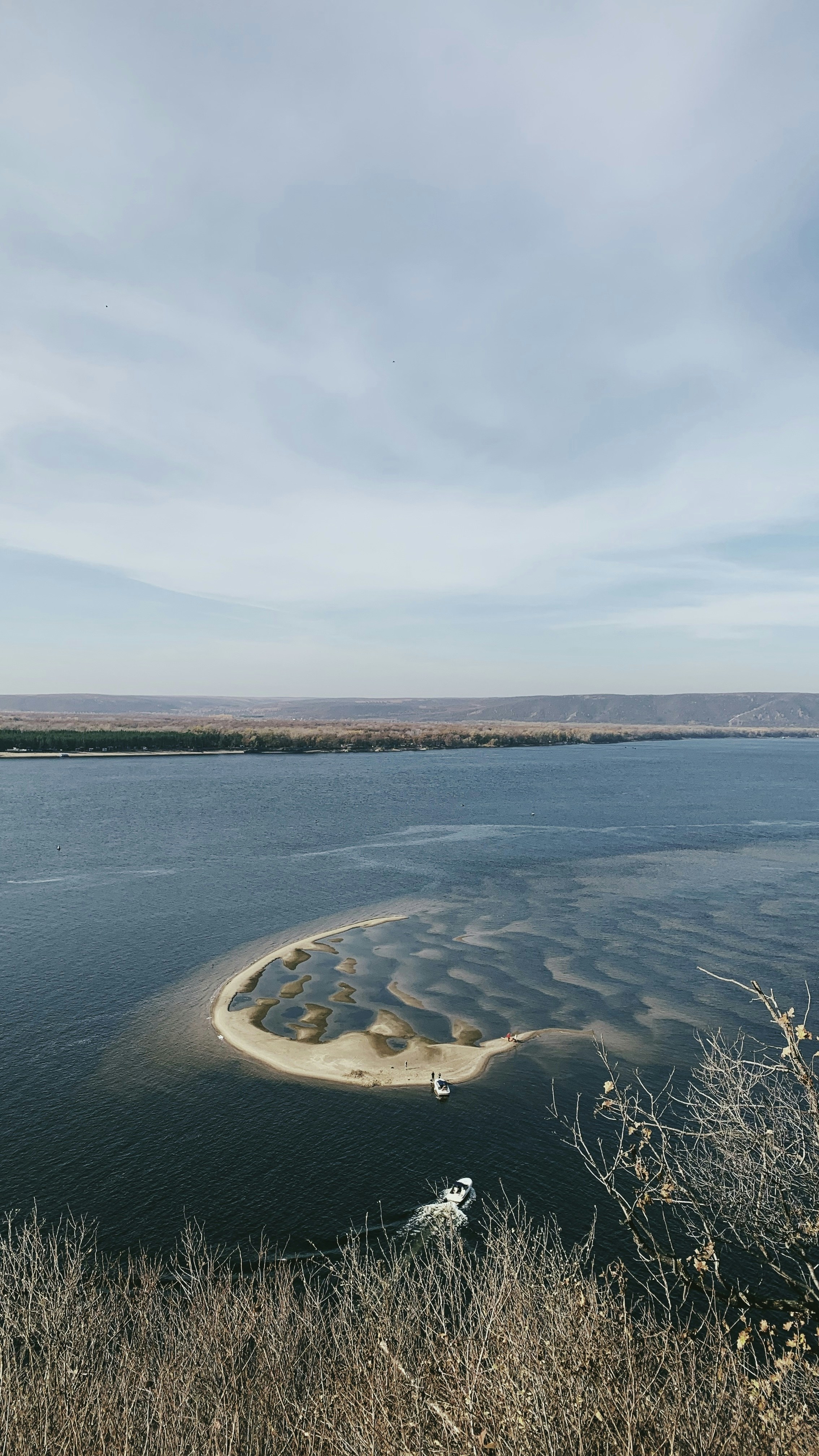 body of water under cloudy sky during daytime