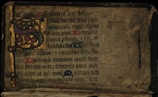 a very old book with some writing on it