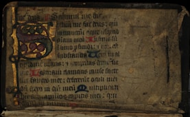 a very old book with some writing on it