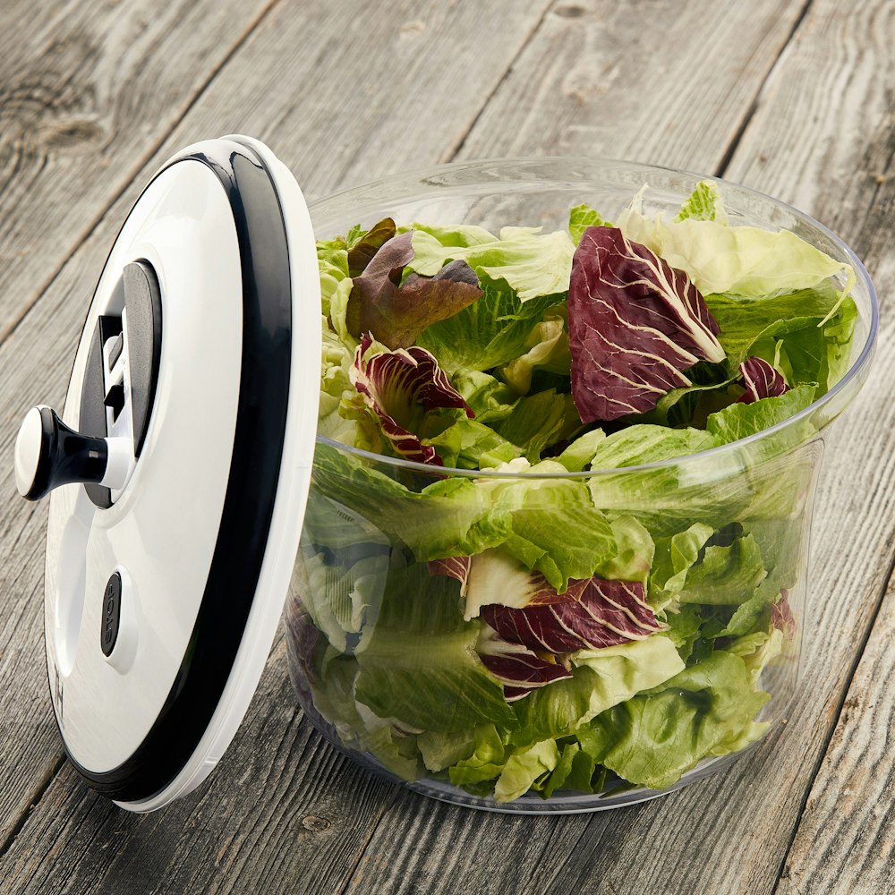 green leaf vegetable in clear glass bowl