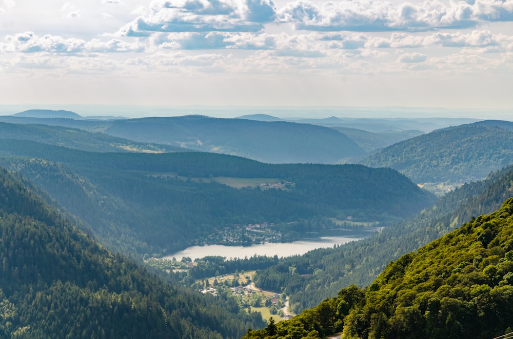 green mountains under white clouds during daytime