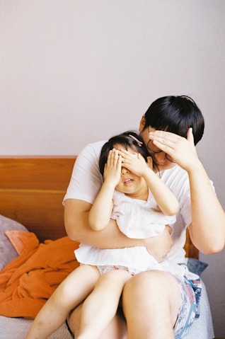 woman in white dress lying on bed