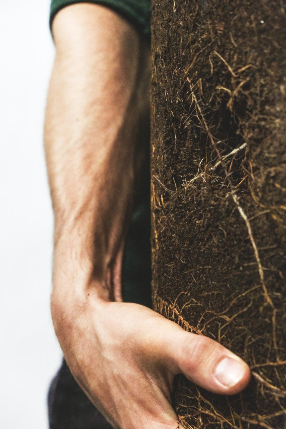 persons left hand on brown textile