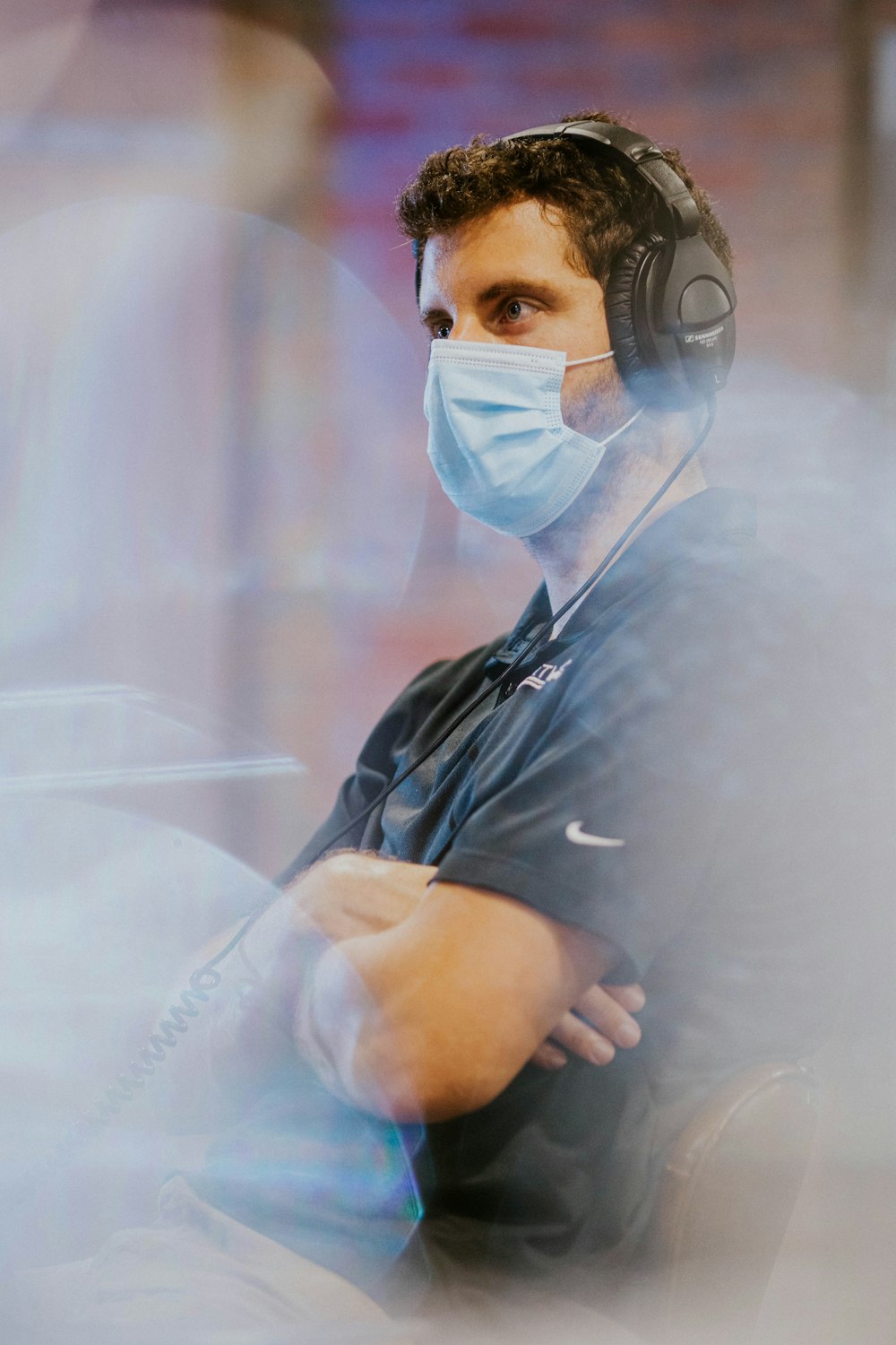 man in black button up shirt wearing white face mask