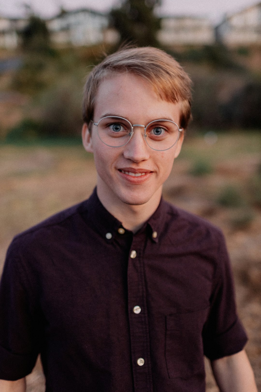 man in black button up shirt wearing eyeglasses