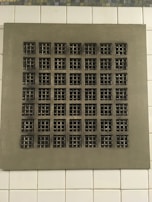 A clean, shiny air vent grate after a detailed cleaning session.