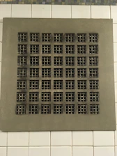 Close-up of a clean ventilation grille with fresh airflow.