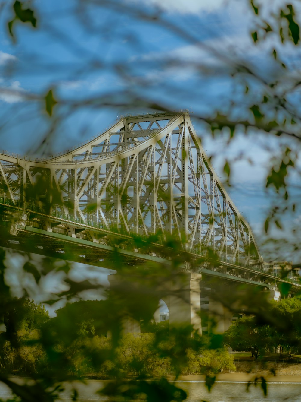 white metal bridge over river