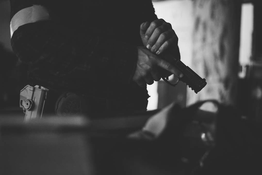 grayscale photo of person holding smartphone