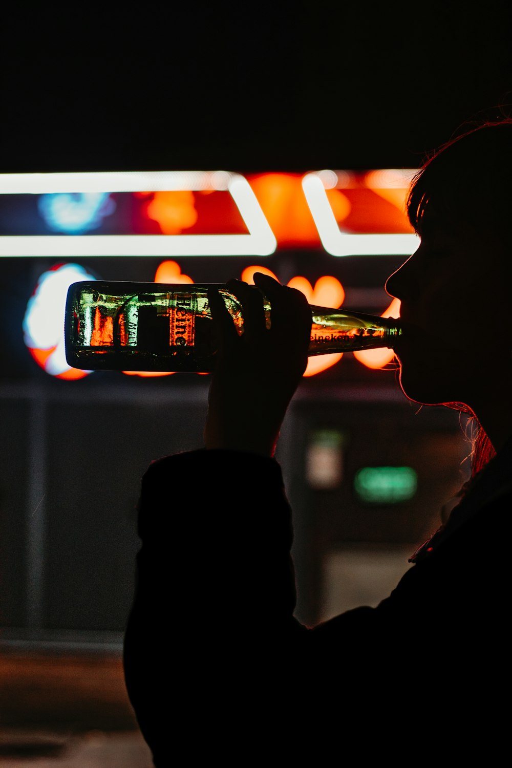 man drinking beer from can