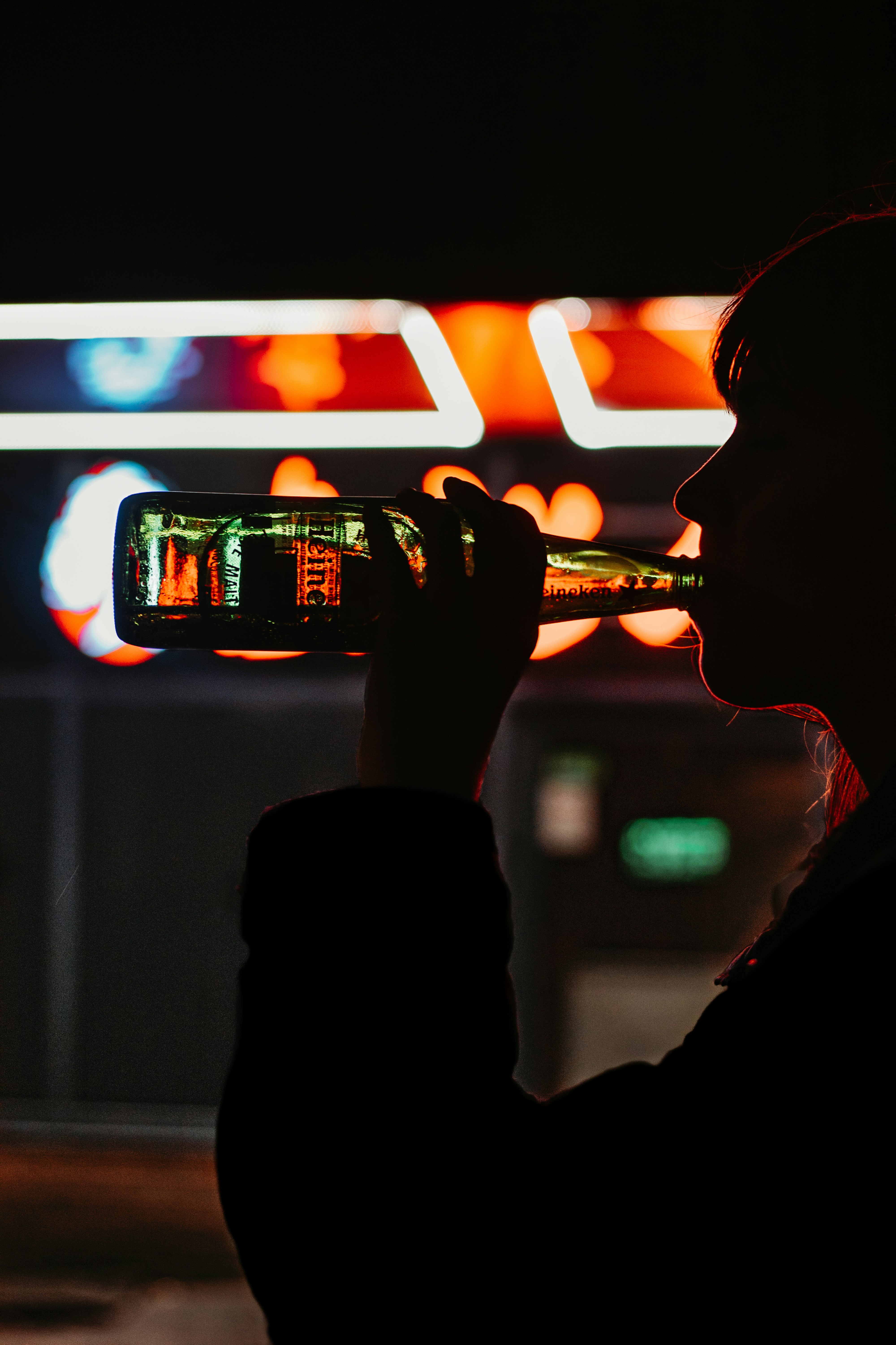 man drinking beer from can