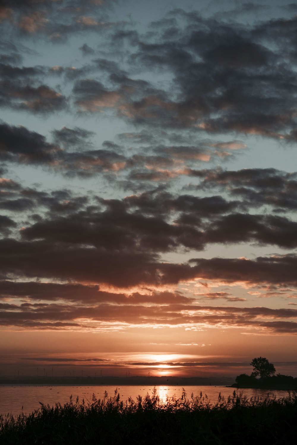 silhouette of clouds during sunset