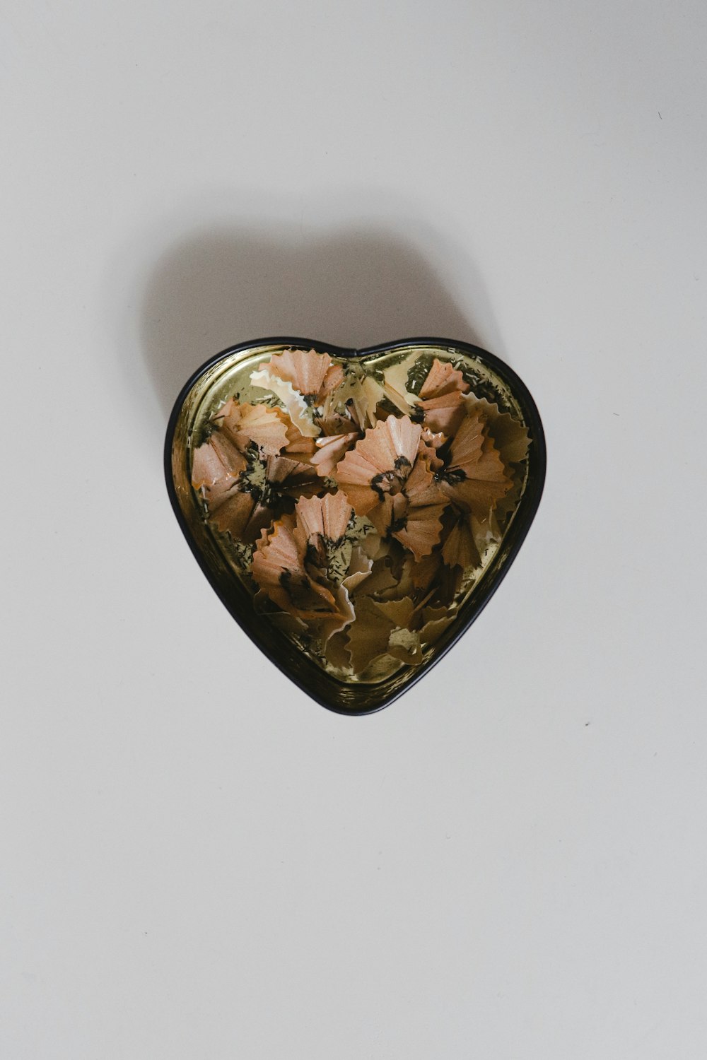 black and brown floral heart shaped ceramic bowl