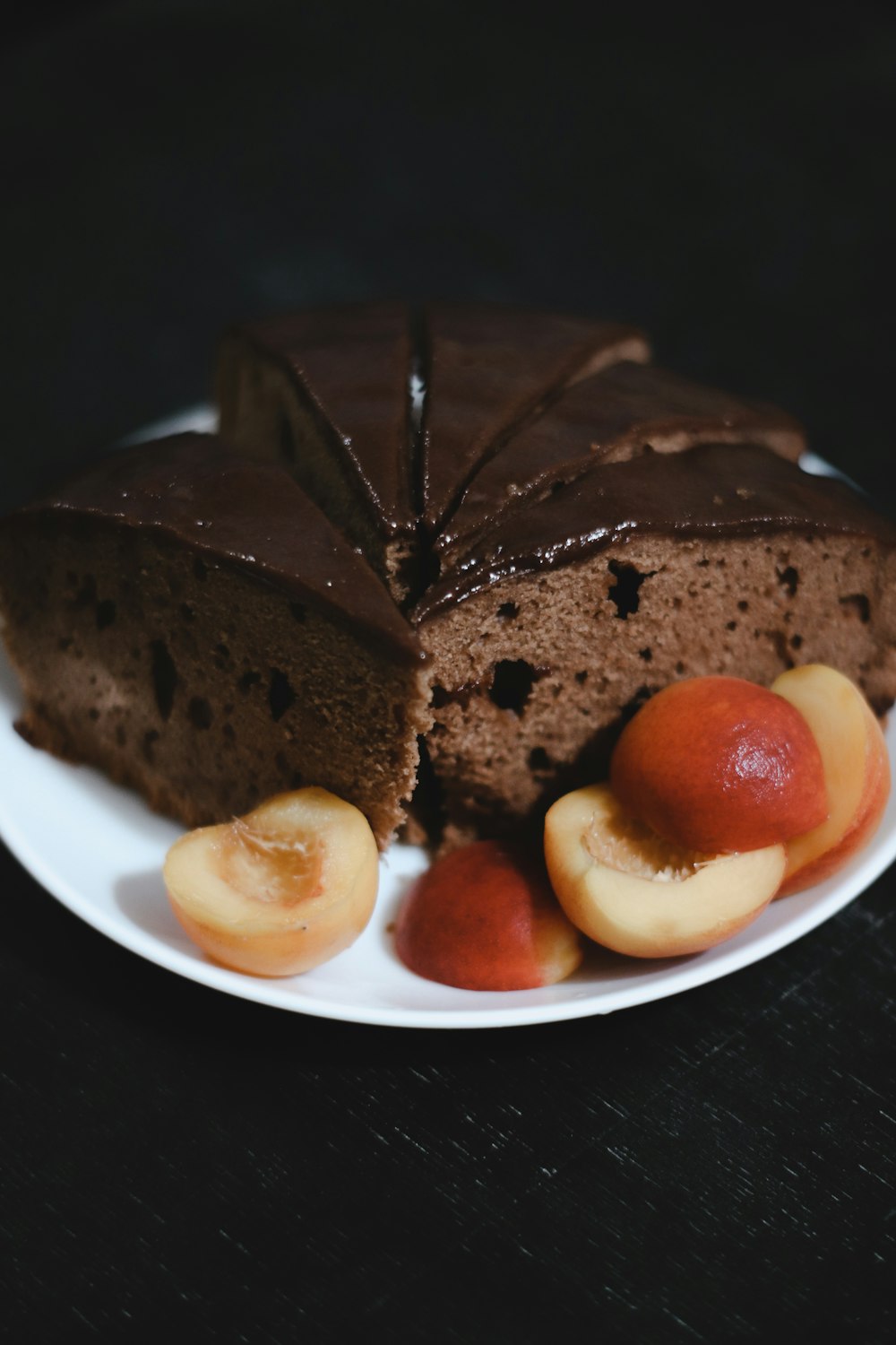 sliced chocolate cake on white ceramic plate