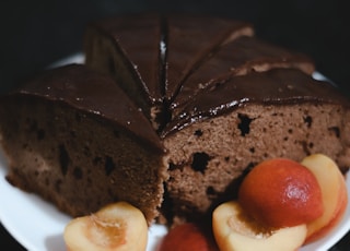 sliced chocolate cake on white ceramic plate