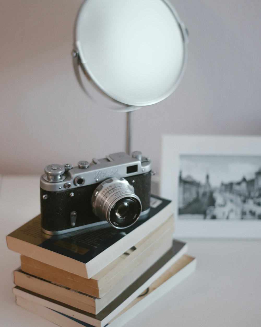 black and silver camera on brown wooden table