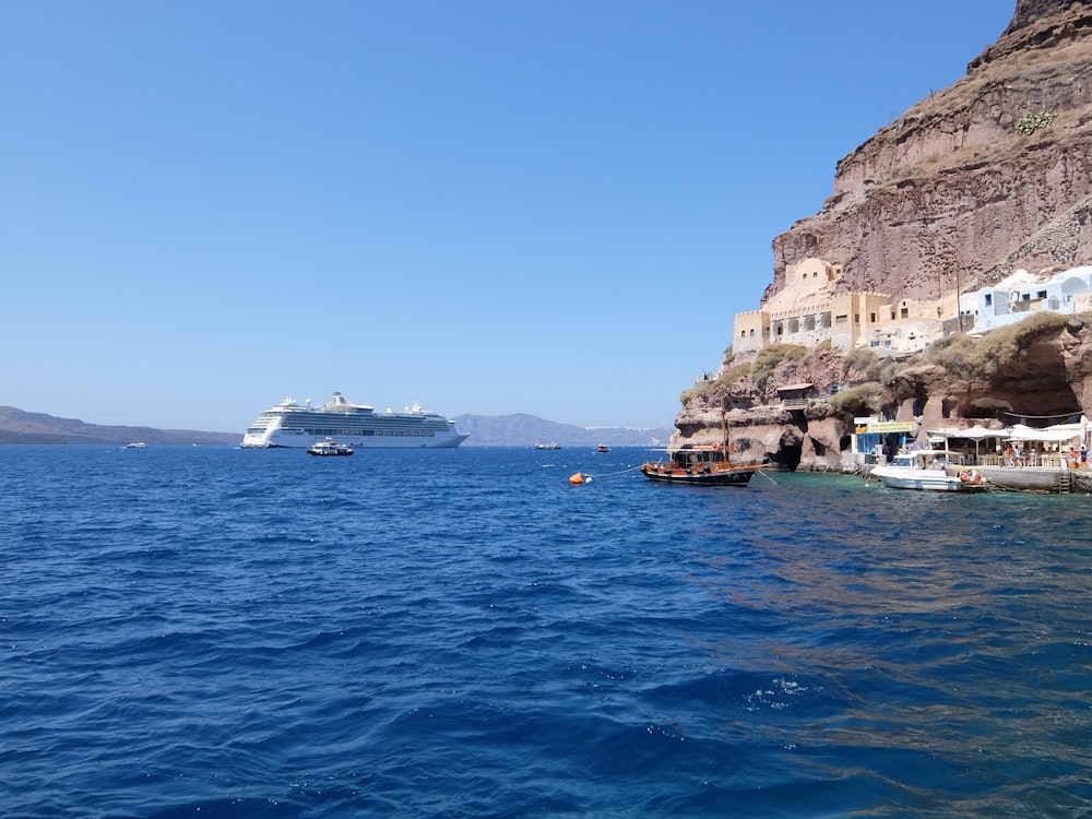 white and brown rock formation on blue sea under blue sky during daytime