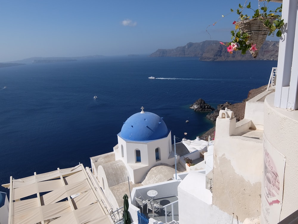 white and blue dome building near body of water during daytime