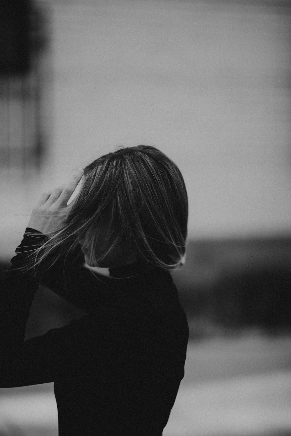 grayscale photo of woman in black long sleeve shirt