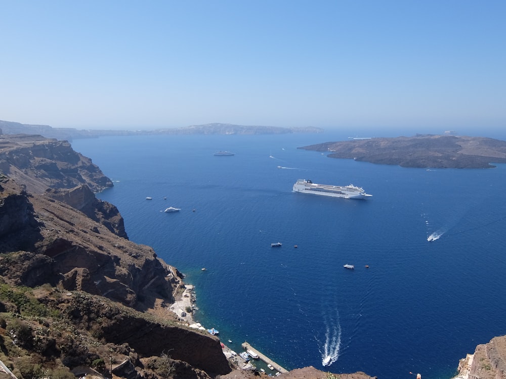 white boat on blue sea during daytime