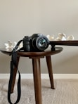 black nikon dslr camera on brown wooden table