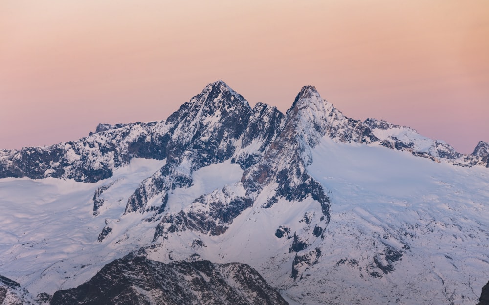 snow covered mountain during daytime