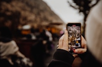 person holding black iphone 5