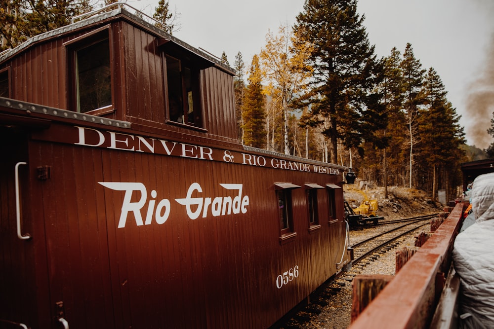 red and white train on rail tracks