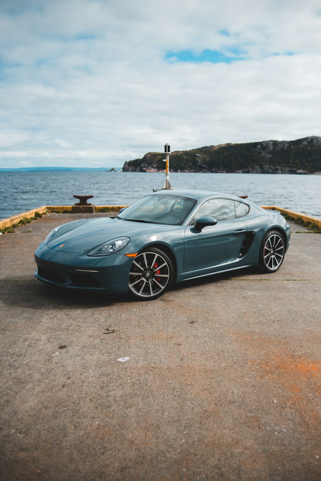 black porsche 911 on beach during daytime