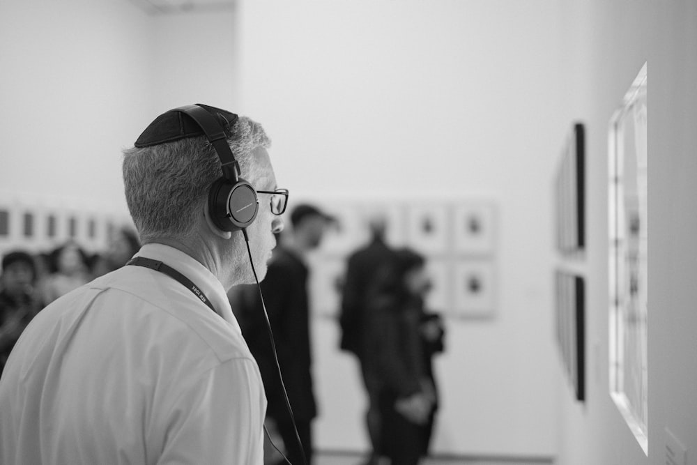 man in white dress shirt wearing black sunglasses