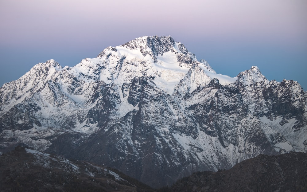 snow covered mountain under blue sky during daytime