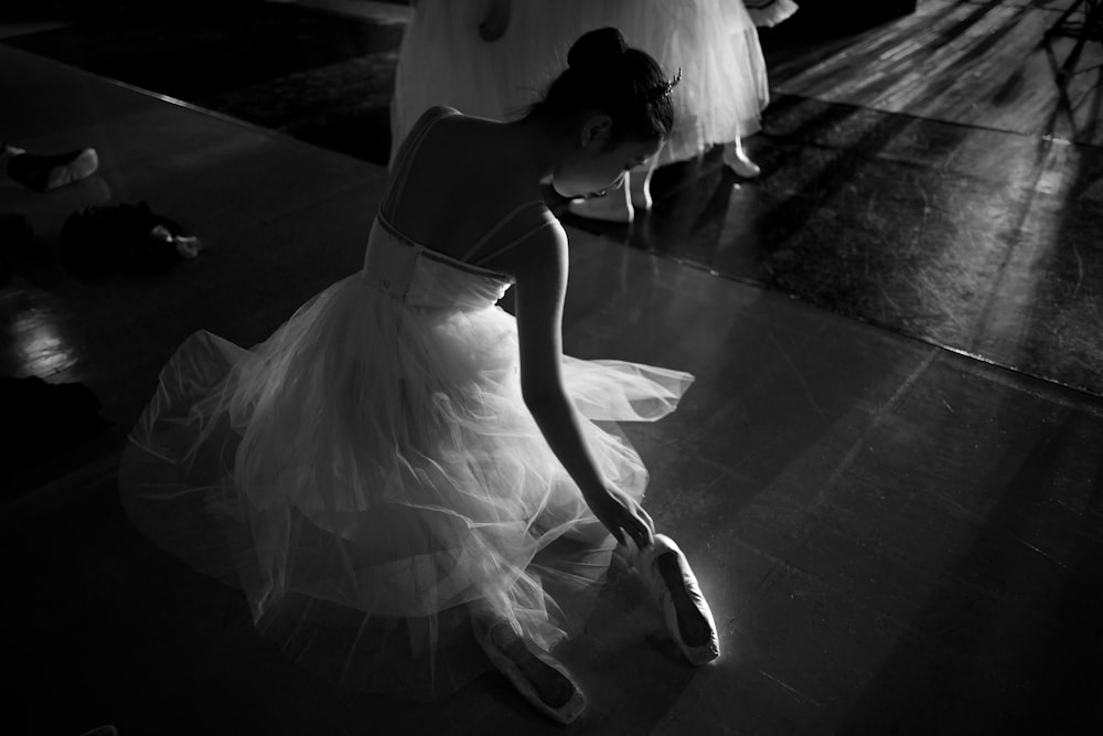 woman in white dress walking on the street