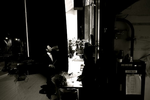 A candid moment of Bossman Hogg reflecting backstage before a performance.