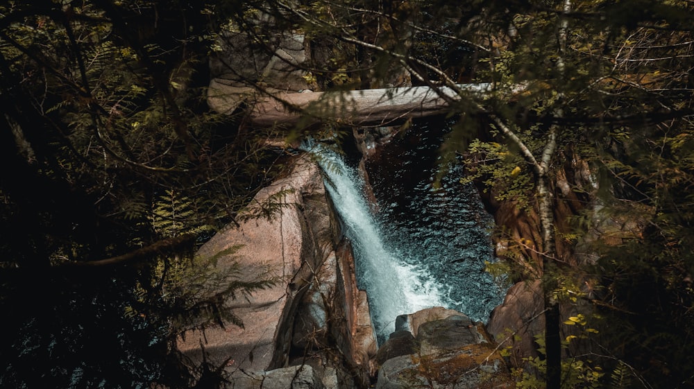 water waves hitting brown rocks