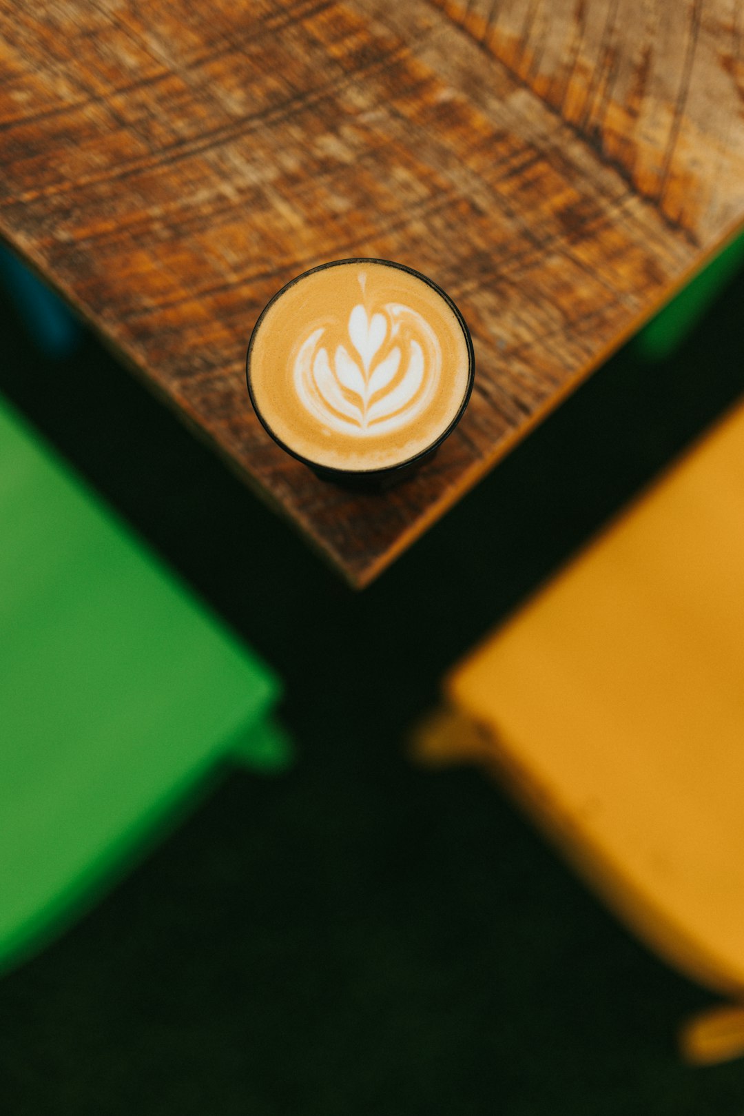 white ceramic mug on brown wooden table